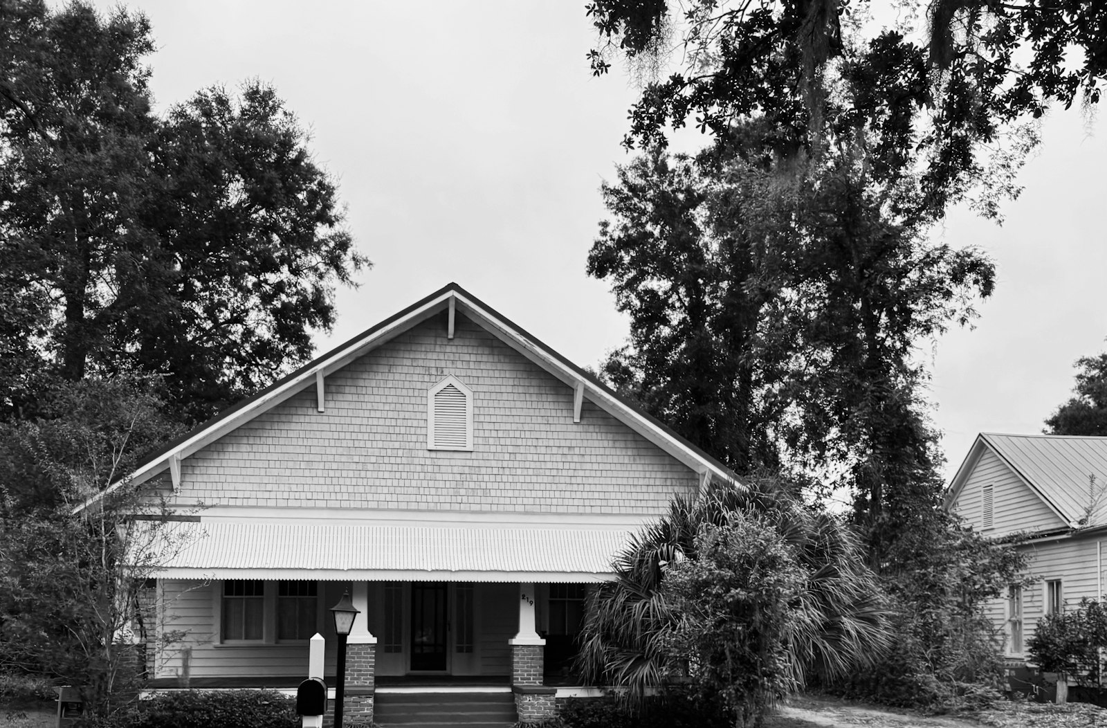 A house with a front porch and trees